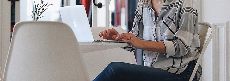 business owner at desk on computer