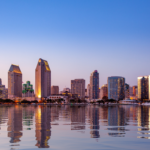 Scenic view of the San Diego, California skyline at dusk, illustrating the thriving economic landscape for local small business owners.